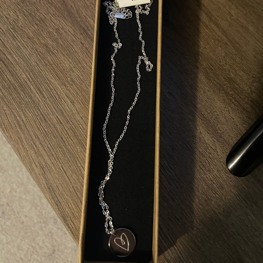 Stainless steel boob/heart necklace